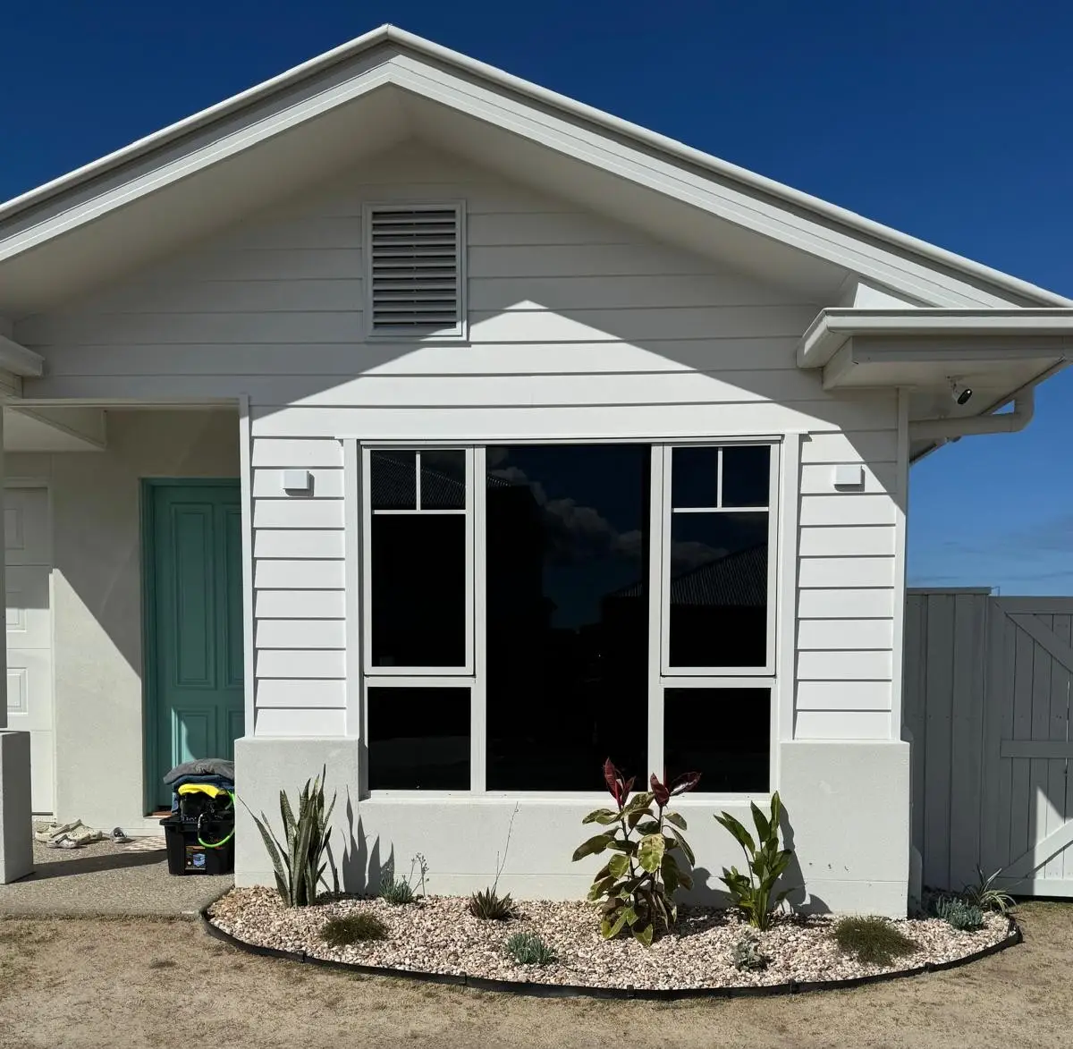 Darker window tint on a large window of a modern Sunshine Coast home